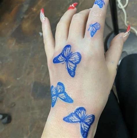 Blue Butterfly Tattoo On Hand Butterfly Hand Tattoo Blue Butterfly