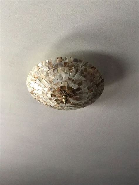 It's quite a transformation, as even the shape of the blades has been changed. Mother of Pearl Ceiling Light Cover | Ceiling light covers, Diy drum shade, Ceiling lights