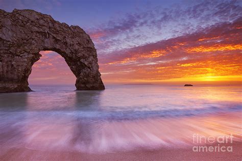 Durdle Door Rock Arch In Southern England At Sunset Photograph By Sara