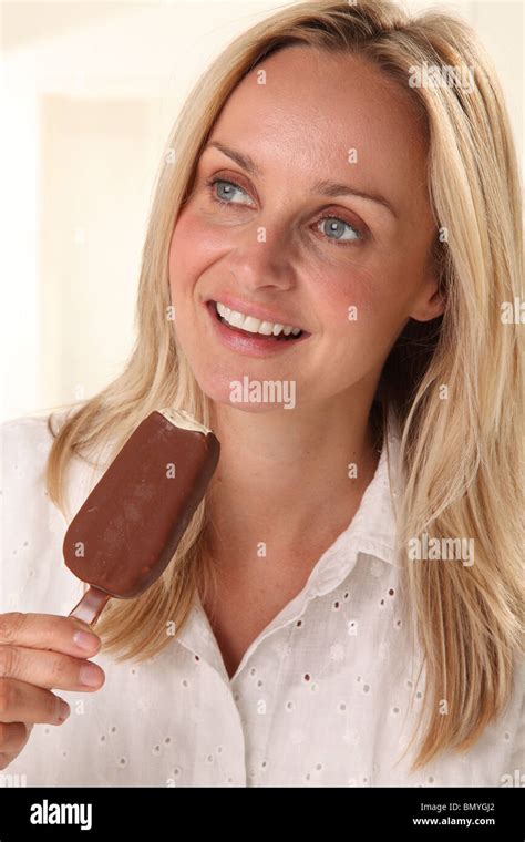 WOMAN EATING CHOCOLATE ICE CREAM BAR Stock Photo Alamy
