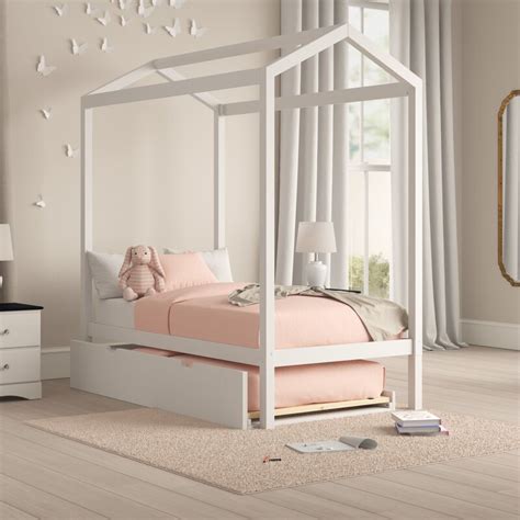 Graced with embellished heart scrolling and a crisp white finish, this twin metal canopy bed is easy to love. Isabelle & Max™ Brionna Twin Canopy Bed with Trundle ...