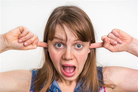 Woman Covering Her Ears To Protect From Loud Noise Stock Photo Image