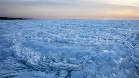 Stunning Pictures As Frozen Lake Michigan Shatters Into Ice Shards