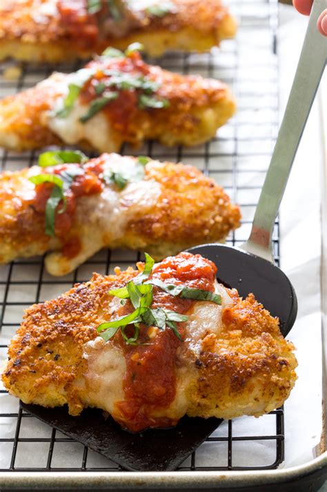 Chicken cutlets, breaded and fried, smothered with tomato sauce, and covered with mozzarella and parmesan cheeses are so good. The Best Crunchy and Creamy Chicken Parmesan - All Created