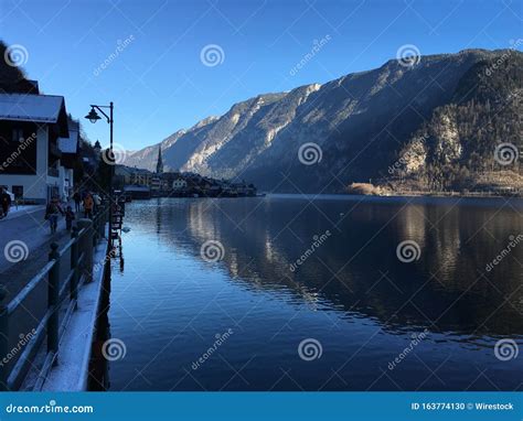 Beautiful Scenery Of The Mountains Reflecting In The Lake In Hallstatt