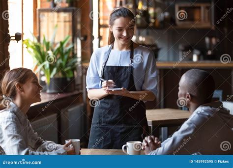 Waitress Welcoming Restaurant Guests Take Order Writing On Notepad Stock Image Image Of