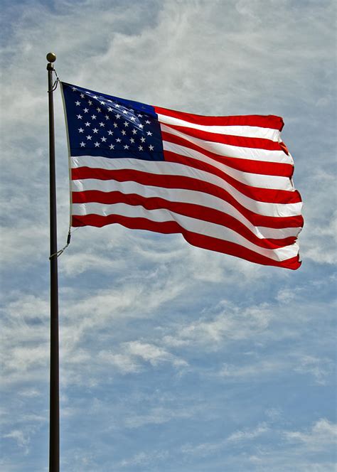The American Flag Waving In The Wind Photograph By Leeann Mclanegoetz