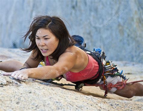 Female Climber Clinging To A Cliff — Stock Photo © Gregepperson 5648283