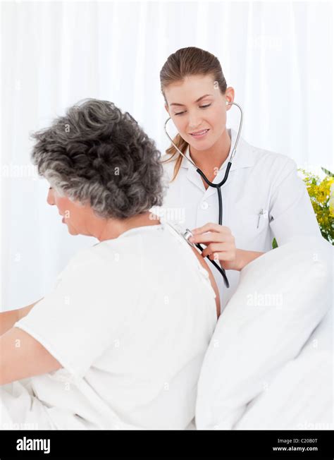 Nurse Taking Care Of Her Patient Stock Photo Alamy