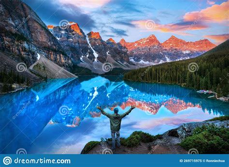 Beautiful Moraine Lake Reflections With Hiker In Awe Of Golden Sunrise