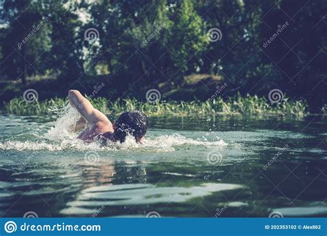 The Young Man Swimming In The River Stock Photo Image Of Adult