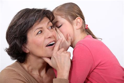 Telling Her Mother a Secret. Stock Image - Image of bonding, happiness