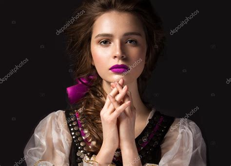 national hairstyle beautiful russian girl in national dress with a braid hairstyle and pink