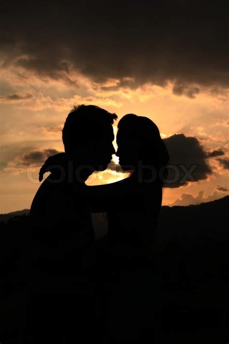 Two Young Lovers Standing On Sunset Stock Image Colourbox