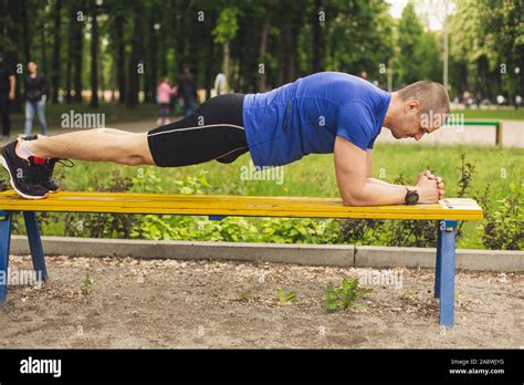 Man Doing Plank Exercise On The Bench Stock Photo Alamy