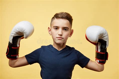 Young Child With Big Boxing Gloves Winning Competition Yellow