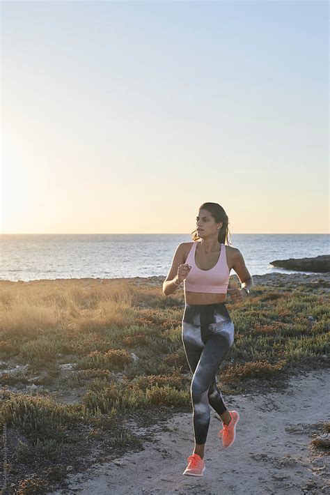 Fitness Woman Running At Sunset By Stocksy Contributor Ivan Gener Stocksy