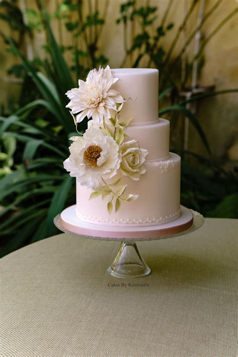 Blush Wedding Cake With Hand Piped Details Adorned With Delicate Sugar