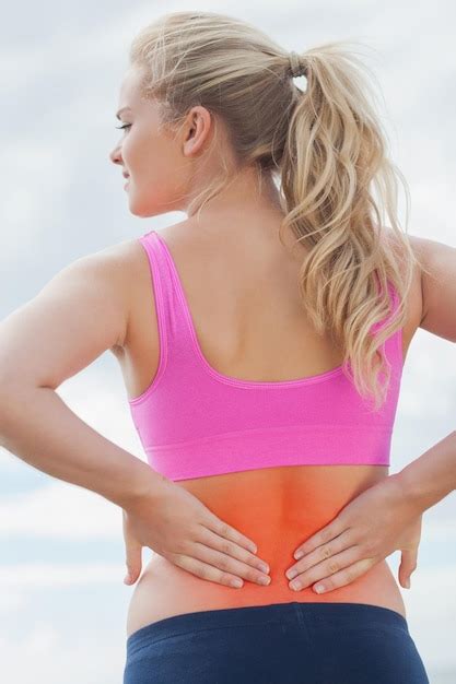 Premium Photo Rear View Of A Healthy Woman In Sports Bra Suffering