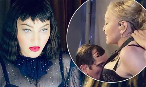 Madonna Dons A Very Busty Corset And Rests A Mans Head Between Her