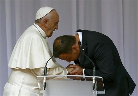 to kiss pope s hand or not enters the catholic culture wars
