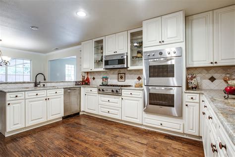 What i do for many of my clients is add accent tiles with a raised backer, cut to the size of the accent tile ( 1/4 inch plywood), on the back splash that will allow the accents to be. Kitchen Best White Cabinets With Black Appliances Painting ...