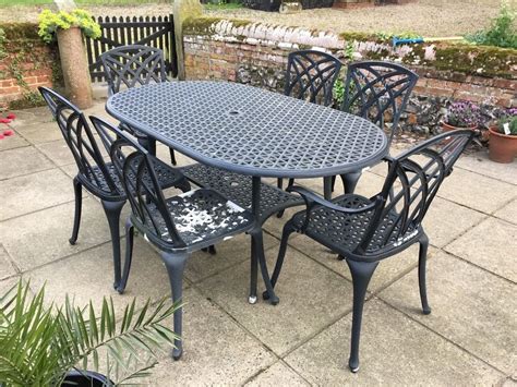 If your goal is to make a statement, find one that features a lattice. Cast Metal Garden Furniture Set In Norwich Norfolk Table ...