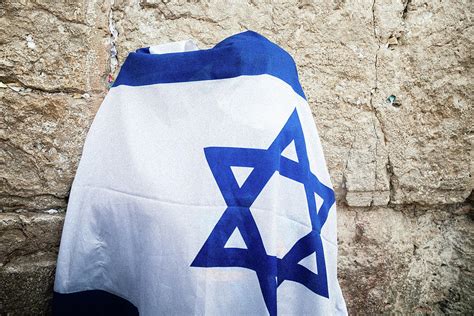 Man Covered With Israel Flag Praying At The Wailing Wall Kotel