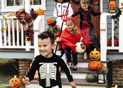 Young Kids Trick Or Treating During Halloween Premium Image By