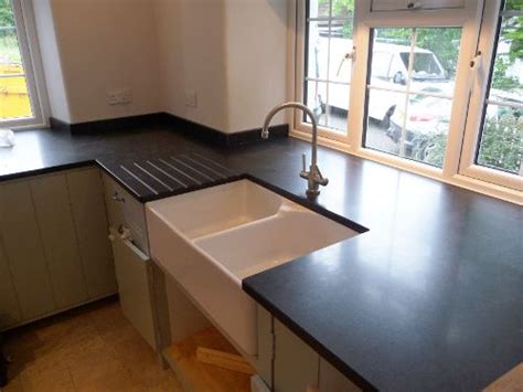 Ise 45+ continuous feed waste disposal unit. Black counter with drainboard and FH sink. | Belfast sink ...