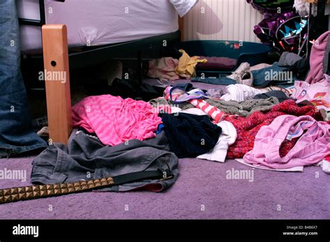 Clothes On Floor Of Messy Teenagers Bedroom Stock Photo Alamy