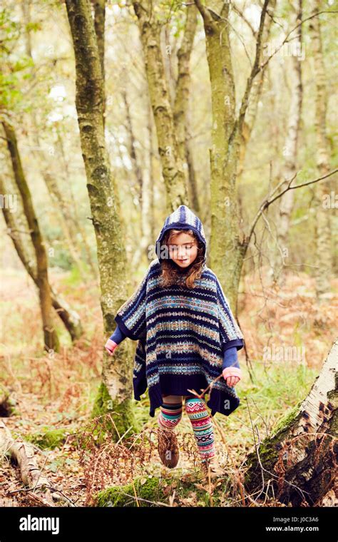Young Girl Walking Through Forest Stock Photo Alamy
