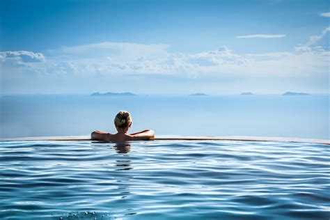 Woman Relax In Infinity Swimming Pool On Vacation Alicia Morrow