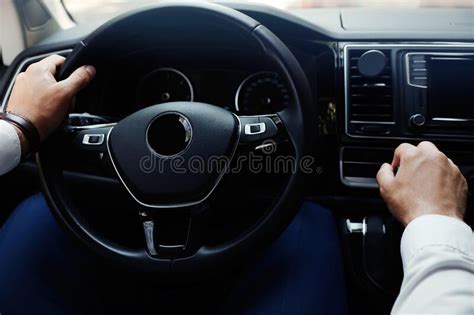 Man Driving His Car Closeup View Of Hands On Steering Wheel Stock