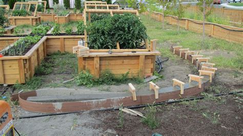 How to make concrete edging for a garden. We want to put a curb edging around the raised beds. We decided to do a sort of hand-made adobe ...
