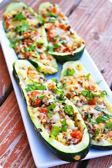 Tender zucchini filled with a silky meat sauce, topped with cheese and baked until tender. Spicy Italian Stuffed Zucchini Boats