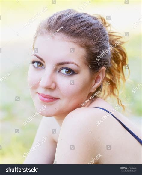 Portrait Of A Beautiful 20 Year Old Woman Enjoying A Summer Day Outdoor