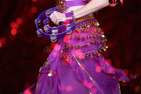 Belly Dancer Wearing Purple Dance Costume Close Up With Bokeh Stock