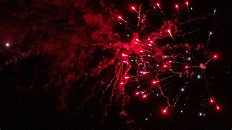 Download Wallpaper 2560x1440 Fireworks Sparks Smoke Red Dark Night