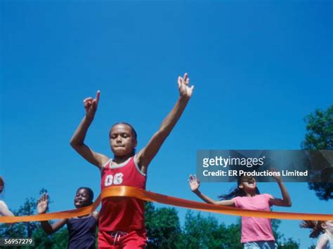 Girl Crossing Finish Line Photos And Premium High Res Pictures Getty