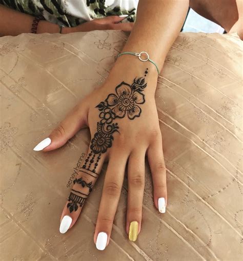 Simple Small Henna Hand Tattoo