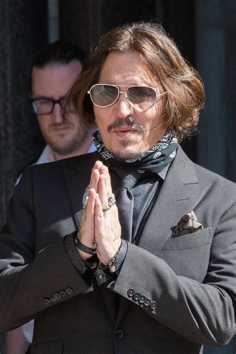 Johnny Depp in a Gray Suit Arrives at the Royal Courts of Justice in