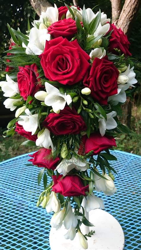 They range from varieties that skim the ground to those towering 6 feet high. Sandra's Flower Studio: Red rose and white freesia wedding ...