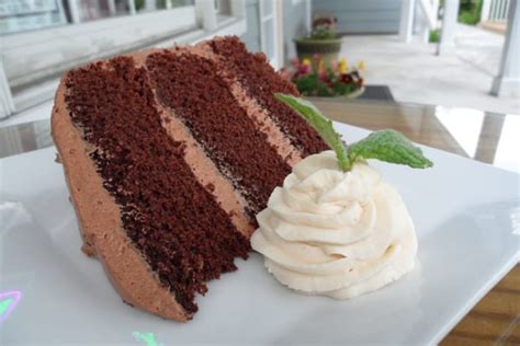 3 tier chocolate cake with homemade chocolate butter cream frosting and whipped cream yelp