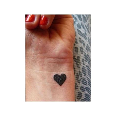Small Black Heart Tattoo On Wrist Liked On Polyvore Featuring Tattoos Black Heart Tattoos