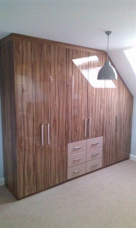 This fitted bedroom furniture is. Ultra Gloss Woodgrain Sloping Ceiling Angled Wardrobes # ...