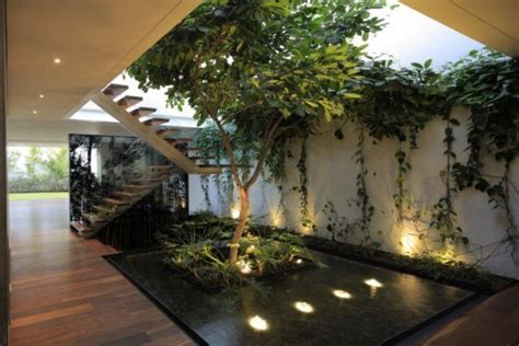 Modern Home With Indoor Garden Also Wooden Laminate Floor Also Stair
