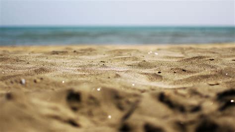 Closeup View Of Beach Sand In Blur Beach Background Hd Sand Wallpapers