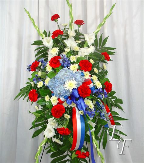 Typically, a standing spray or standing wreath is ordered, which means that the arrangement is placed on a easel so that it can be prominently displayed at a funeral service.a wreath is a design in which the plants and. Military Tribute Standing Spray EF-206 | Essex Florist ...
