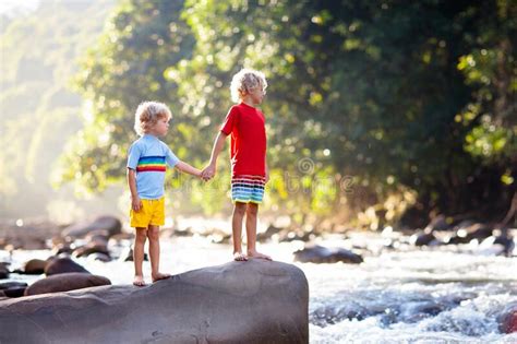 Child Hiking In Mountains Kids At River Shore Stock Photo Image Of